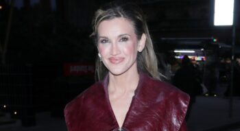 Ashley Roberts barely covers herself as she goes topless in the sea