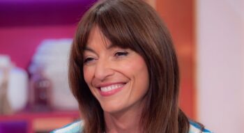 Davina McCall stuns in a tiny pink bikini as she shows off her abs
