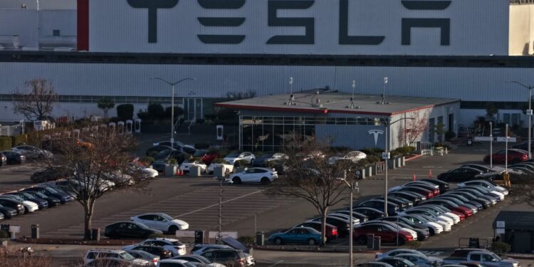 Tesla defends employees accused of using N-word